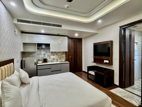 Kuchyň nebo kuchyňský kout v ubytování QuickIn Stayz by The Aikaya