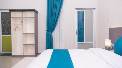 Ένα ή περισσότερα κρεβάτια σε δωμάτιο στο Grand Aulia Hotel