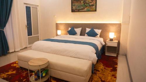 Ένα ή περισσότερα κρεβάτια σε δωμάτιο στο Grand Aulia Hotel