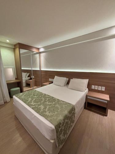 Postel nebo postele na pokoji v ubytování Vista Azul Apart Hotel - Vista Pinheiros