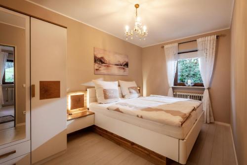 En eller flere senge i et værelse på Bergschlössl Ferienwohnung Nr. 1