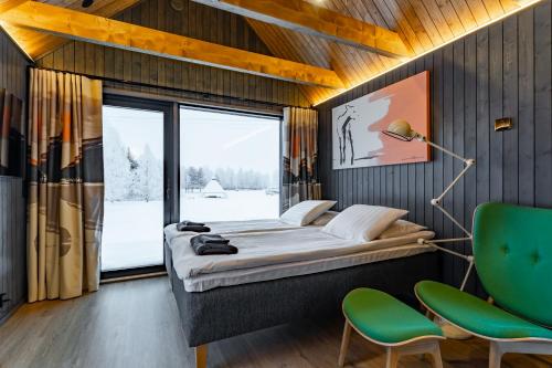 Postel nebo postele na pokoji v ubytování Nilimella - Lapland resort & camping