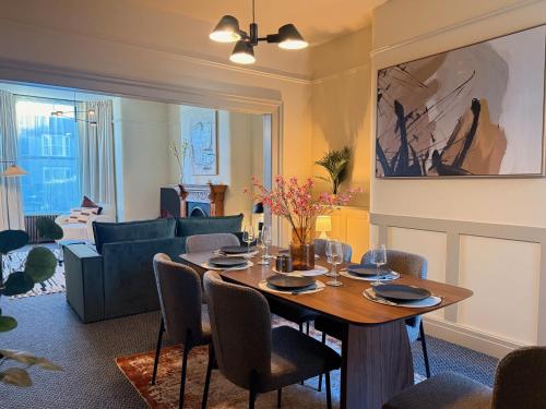 a living room with a table and a couch at The Meridian in Southport
