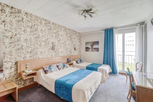 Ένα ή περισσότερα κρεβάτια σε δωμάτιο στο Contact Hôtel des Deux Moulins Limoges - Proche de la gare