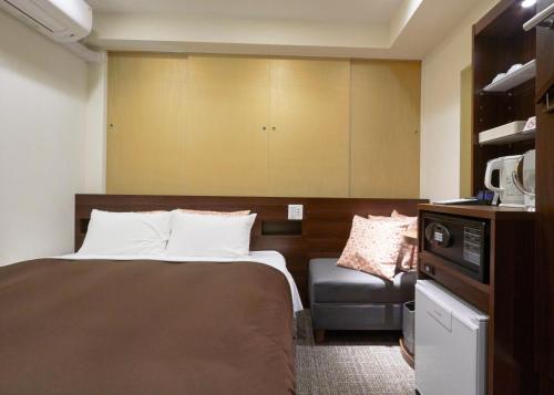 Ένα ή περισσότερα κρεβάτια σε δωμάτιο στο unito hotel residence Kyoto Station North