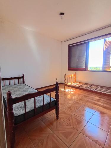 Ένα ή περισσότερα κρεβάτια σε δωμάτιο στο Empresas e viajantes com quartos mobiliados temporada