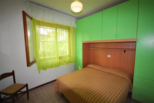 Ένα ή περισσότερα κρεβάτια σε δωμάτιο στο Villette Allodola