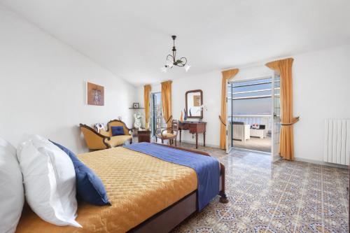 a bedroom with a bed and a living room at Estate4home - Villa Luisa Jacuzzi&Pool in SantʼAgata sui Due Golfi