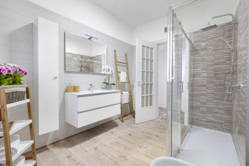 a bathroom with a sink and a shower at Estate4home - Villa Luisa Jacuzzi&Pool in SantʼAgata sui Due Golfi