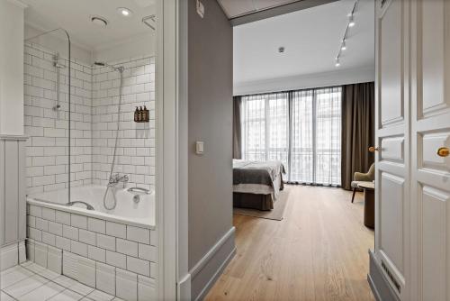 Vannituba majutusasutuses Home Hotel Bastion