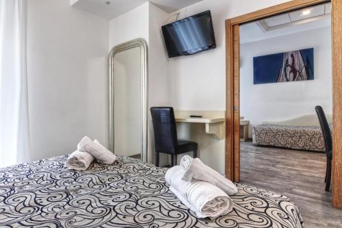 Postel nebo postele na pokoji v ubytování Hotel Riz