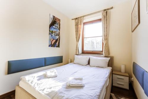 Postel nebo postele na pokoji v ubytování Parkowa Polana, Sun & Snow