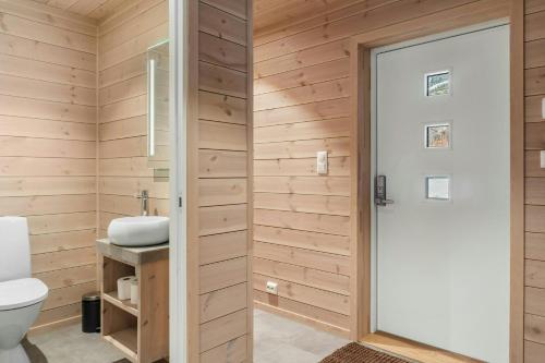 a bathroom with a toilet and a sink at Modern Mountain Cabin Near Norefjell in Eggedal