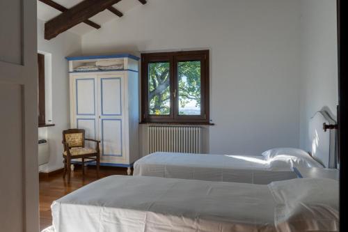 En eller flere senge i et værelse på Residenza Lovely