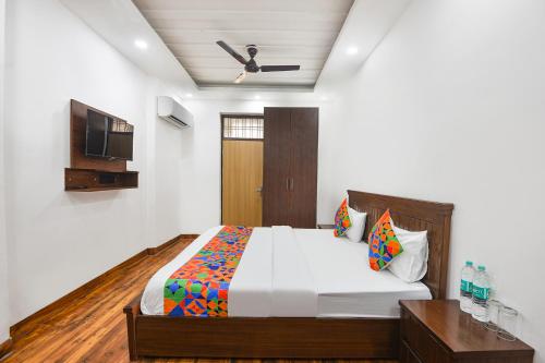 Ένα ή περισσότερα κρεβάτια σε δωμάτιο στο FabHotel The Dream Inn