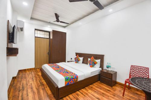 Ένα ή περισσότερα κρεβάτια σε δωμάτιο στο FabHotel The Dream Inn