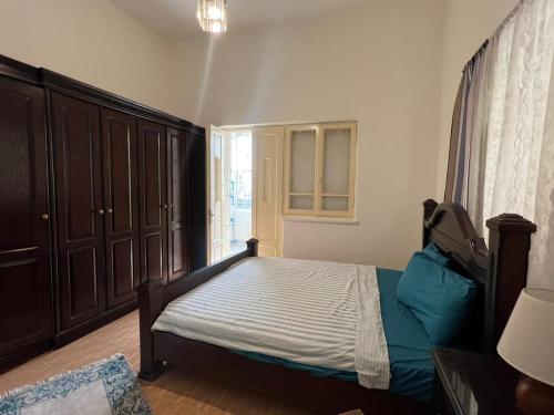 Postel nebo postele na pokoji v ubytování Locations Amman Palm Tree 4