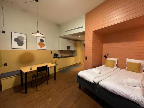 Una cama o camas en una habitación de Forenom Aparthotel Malmö Varvsstaden