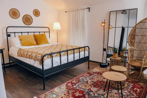 a bedroom with a bed and a table and chairs at Open Concept Boutique Hotel - free breakfast & parking in Belgrade