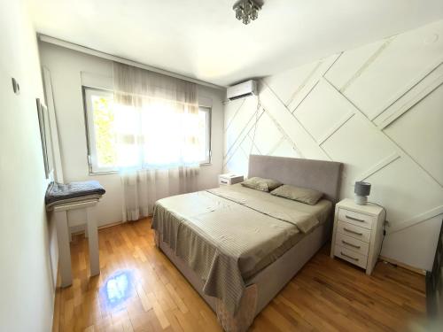 Ένα ή περισσότερα κρεβάτια σε δωμάτιο στο Luxury apartment Podgorica