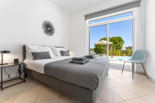 En eller flere senge i et værelse på Duas Palmeiras