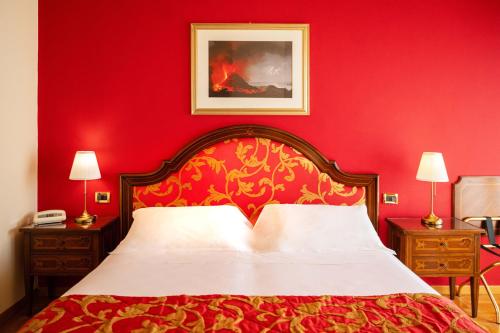 Postel nebo postele na pokoji v ubytování Hotel Isabella