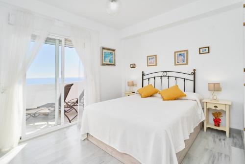 Кровать или кровати в номере Vistas al mar - La Herradura