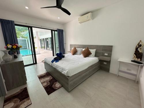 Postel nebo postele na pokoji v ubytování Maret Pool Villa Samui มะเร็ต พูลวิลล่า สมุย