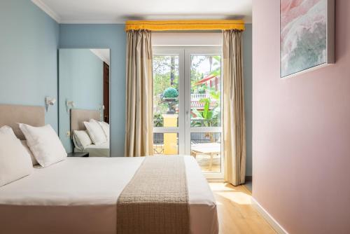 Ένα ή περισσότερα κρεβάτια σε δωμάτιο στο BYPILLOW Villa Lorena Adults Recommended