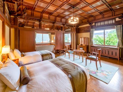 Postel nebo postele na pokoji v ubytování The Fujiya Hotel