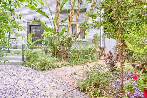 a house with a black door and some plants at Central Hollywood Homestay Getaway in Los Angeles