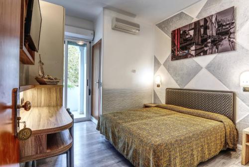 Postel nebo postele na pokoji v ubytování Hotel Riz