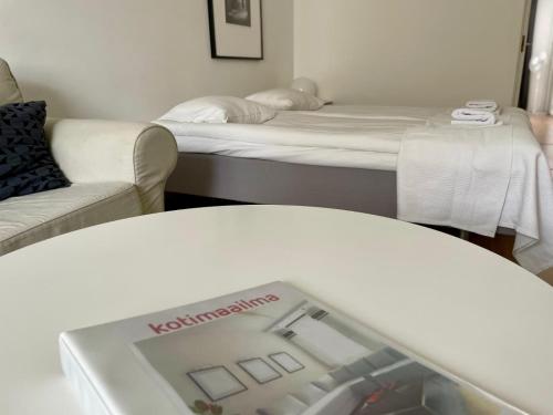 Ένα ή περισσότερα κρεβάτια σε δωμάτιο στο Downtown apartment for 4 - Kotimaailma