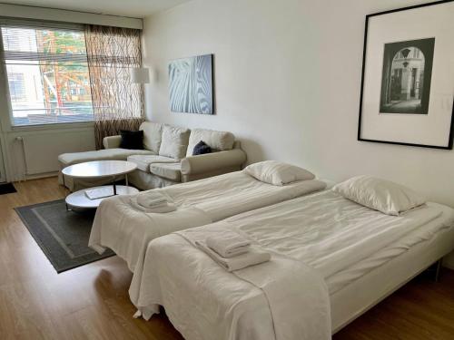 Ένα ή περισσότερα κρεβάτια σε δωμάτιο στο Downtown apartment for 4 - Kotimaailma