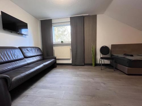 TV a/nebo společenská místnost v ubytování Monteurhaus in Hemer - Gemeinschaftsnutzung Küche und Bad