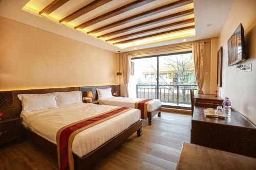 Ένα ή περισσότερα κρεβάτια σε δωμάτιο στο Royal Jungle Villas