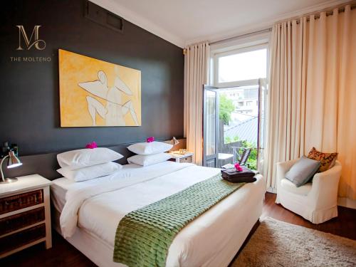 Giường trong phòng chung tại The Molteno