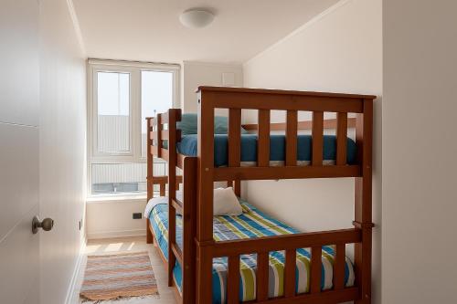 Ένα ή περισσότερα κρεβάτια σε δωμάτιο στο Depto centro Valdivia vivo Caupolican 243