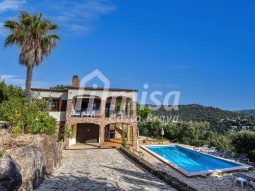 an image of a villa with a swimming pool at Villa Paradise in Calonge