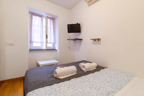 Ένα ή περισσότερα κρεβάτια σε δωμάτιο στο Piazza Venezia Suite Apartment