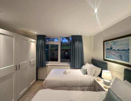 En eller flere senge i et værelse på Terrace by the Tide