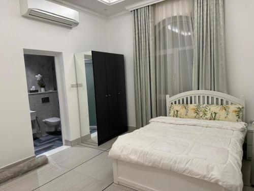 Postel nebo postele na pokoji v ubytování منتزه كشيشه الرحمانية