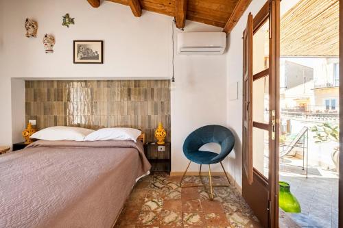Postel nebo postele na pokoji v ubytování La Finestra su Noto