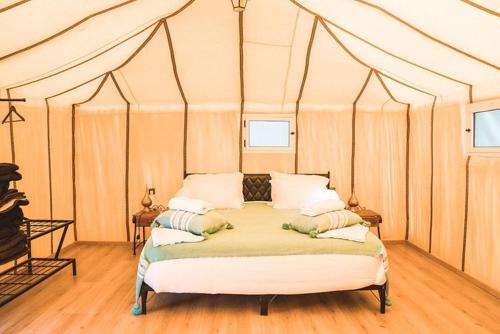 Una cama o camas en una habitación de kasbah estrella