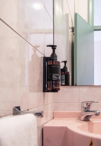 a bathroom with a sink and a mirror at Milano Simple in Bellaria-Igea Marina