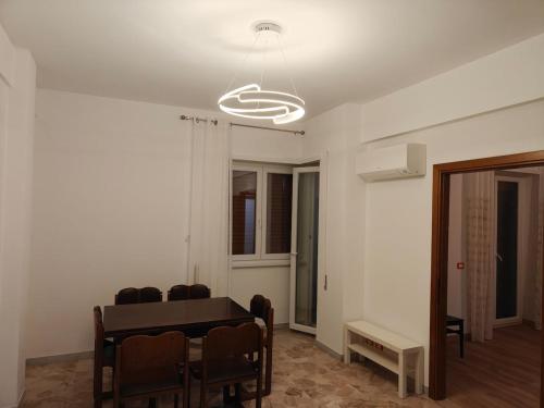 a dining room with a table and chairs at EUR Laurentina vacation home in Rome