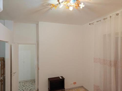 a room with a ceiling with a chandelier at EUR Laurentina vacation home in Rome