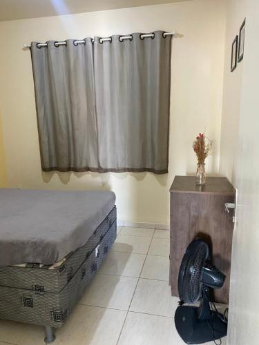 Ένα ή περισσότερα κρεβάτια σε δωμάτιο στο Residencial Arcoiris