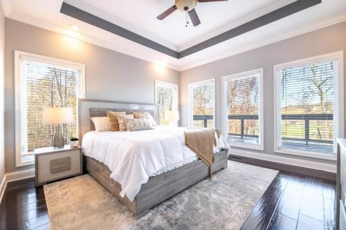 a bedroom with a bed and a ceiling fan at Tranquility Paradise in Sevierville