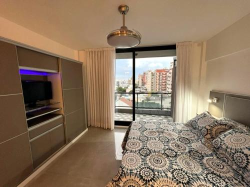 Ένα ή περισσότερα κρεβάτια σε δωμάτιο στο Dzain 1 - PISCINA -Gym- Cochera - Parrilla- Playromm- cercania Garrahan, favaloro, Britanico